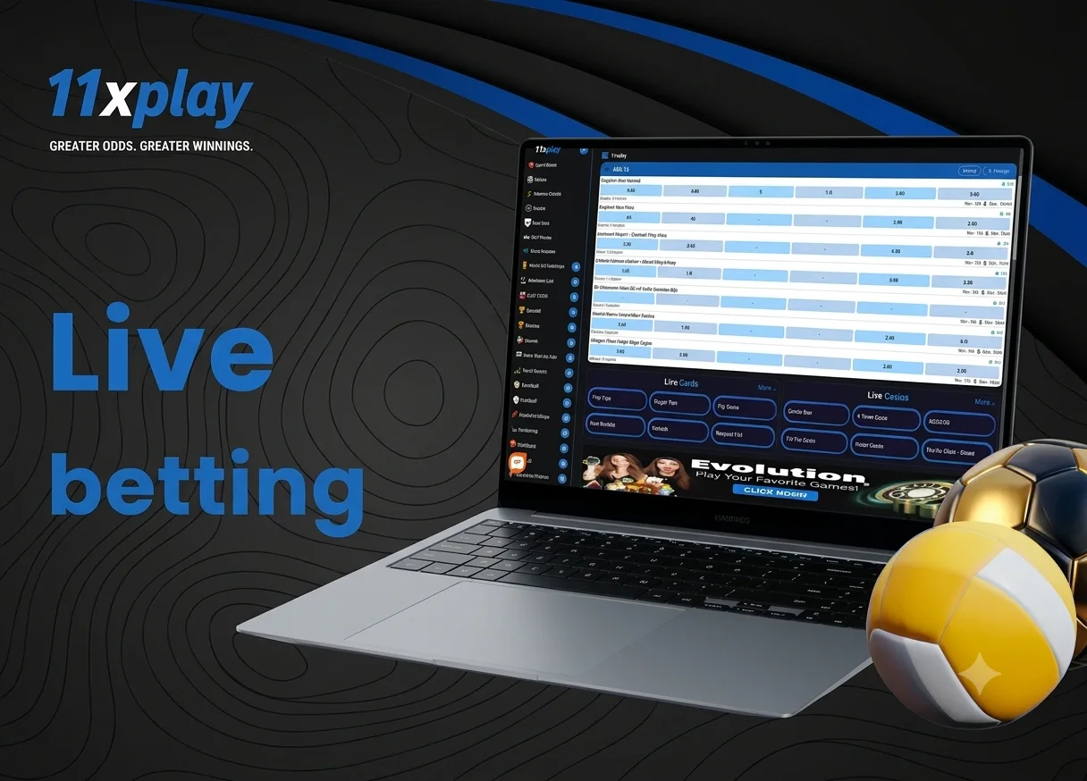 Laptop showing a live sports scoreboard with football and volleyball equipment beside it.
